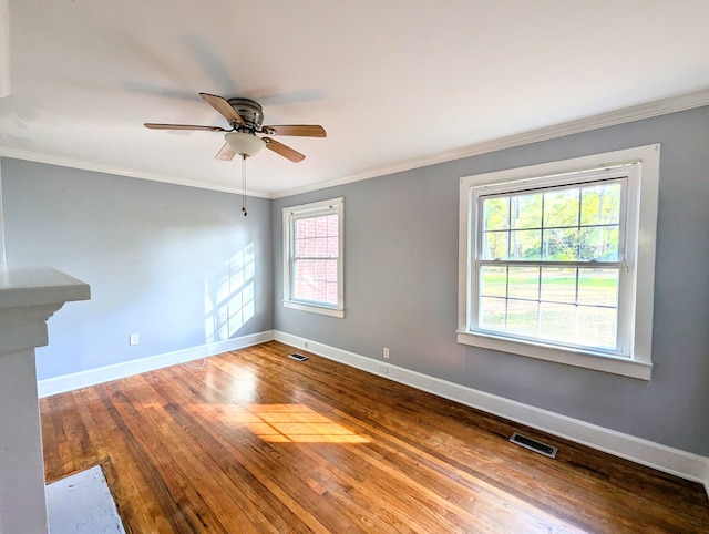 spare room with hardwood / wood-style flooring, ceiling fan, and ornamental molding