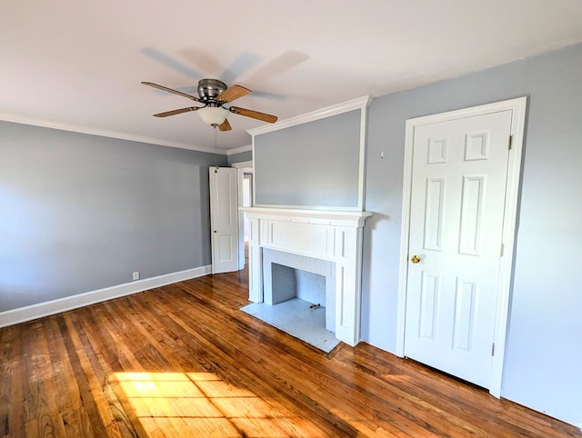 unfurnished living room featuring ceiling fan, dark hardwood / wood-style flooring, and ornamental molding