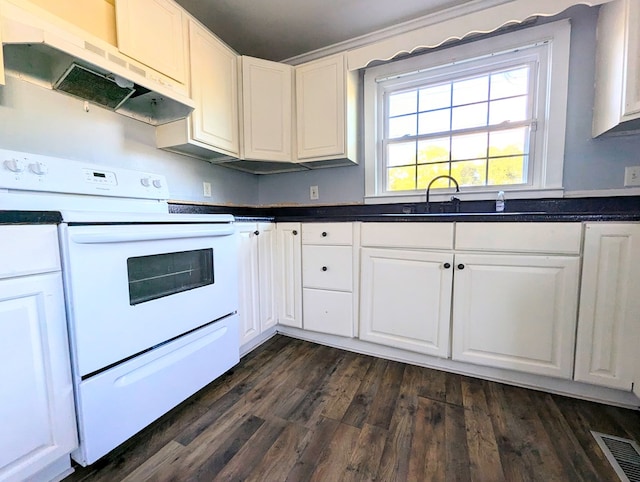 kitchen with dark wood-type flooring, sink, exhaust hood, white electric range, and white cabinetry