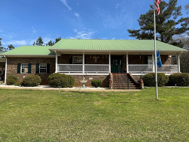 view of front facade with a front yard and a porch