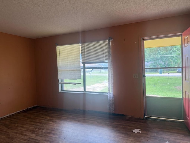 516 Gammage Rd, Eufaula, AL 36027 - empty room with wood finished floors and a textured ceiling