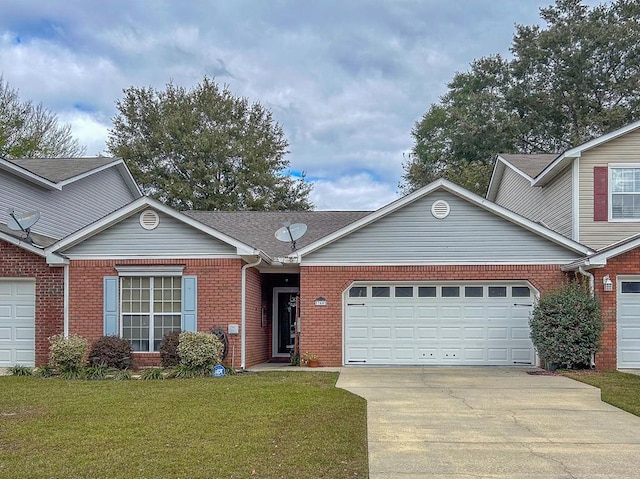 view of front of house with a garage and a front lawn