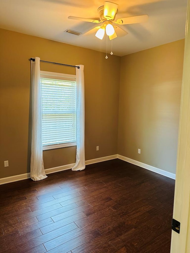 2703 Peachtree Dr, Dothan, AL 36303 - unfurnished room featuring a ceiling fan, dark wood-type flooring, and baseboards
