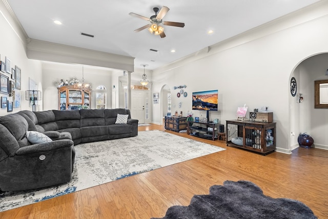 114 Bluffton Rd, Dothan, AL 36301 - living area featuring arched walkways, ceiling fan, wood finished floors, crown molding, and recessed lighting