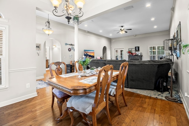 114 Bluffton Rd, Dothan, AL 36301 - dining space with arched walkways, a ceiling fan, light wood-style floors, recessed lighting, and a chandelier