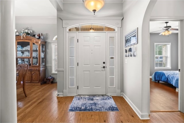 114 Bluffton Rd, Dothan, AL 36301 - foyer entrance with wood finished floors, arched walkways, ceiling fan, and ornamental molding