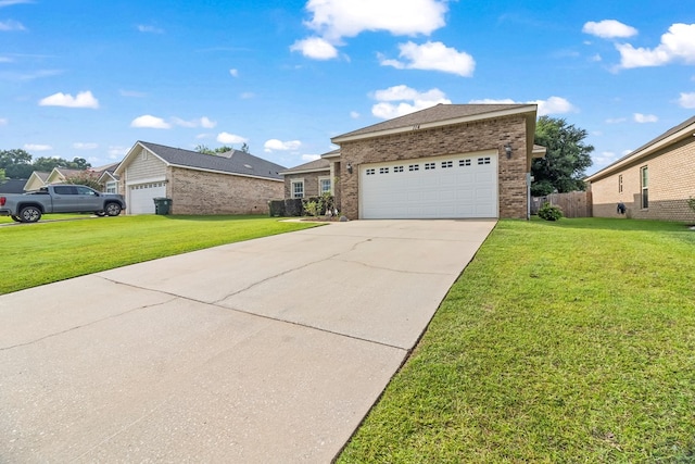 114 Bluffton Rd, Dothan, AL 36301 - view of front of house with brick siding, driveway, a front yard, and a garage