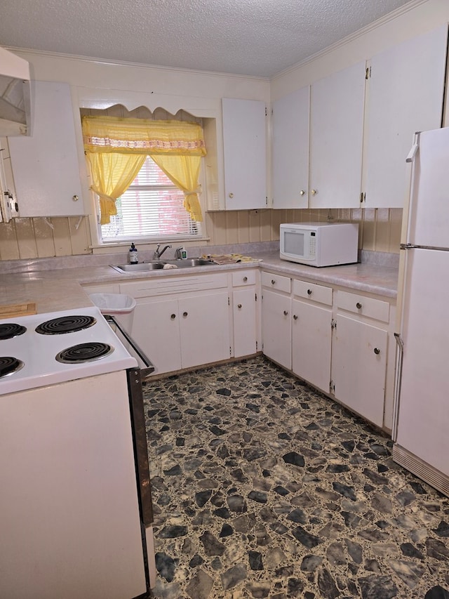 kitchen with white appliances, sink, a textured ceiling, white cabinetry, and extractor fan