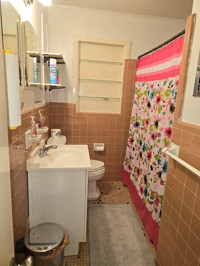 bathroom with a shower with shower curtain, tile patterned floors, tile walls, and crown molding