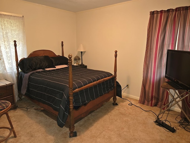 carpeted bedroom featuring ornamental molding