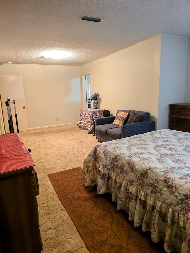 carpeted bedroom with a textured ceiling