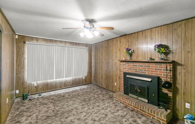 155 Sharon Ln, Ozark, AL 36360 - unfurnished living room with a ceiling fan, wood walls, a fireplace, carpet flooring, and a textured ceiling
