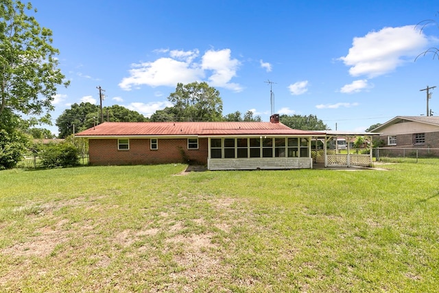 155 Sharon Ln, Ozark, AL 36360 - rear view of property featuring a chimney, a sunroom, metal roof, and brick siding