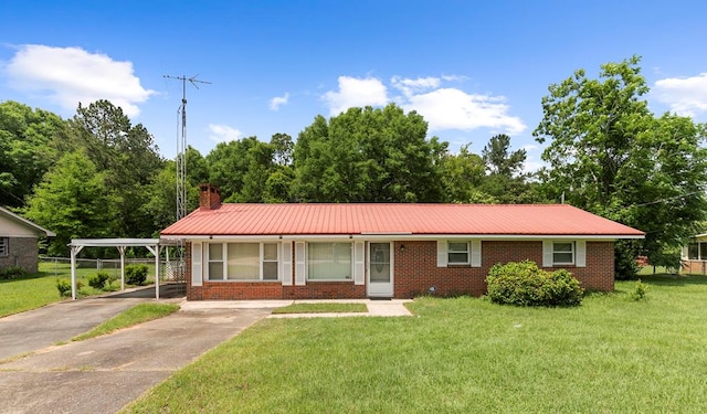 155 Sharon Ln, Ozark, AL 36360 - single story home with brick siding, a front yard, metal roof, and a chimney