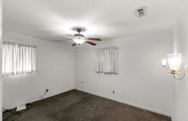 155 Sharon Ln, Ozark, AL 36360 - empty room with ceiling fan, carpet floors, baseboards, and a chandelier