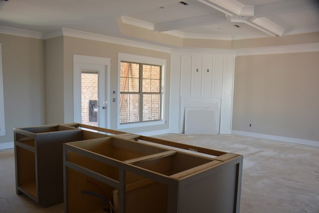 kitchen featuring beamed ceiling, concrete flooring, crown molding, and coffered ceiling