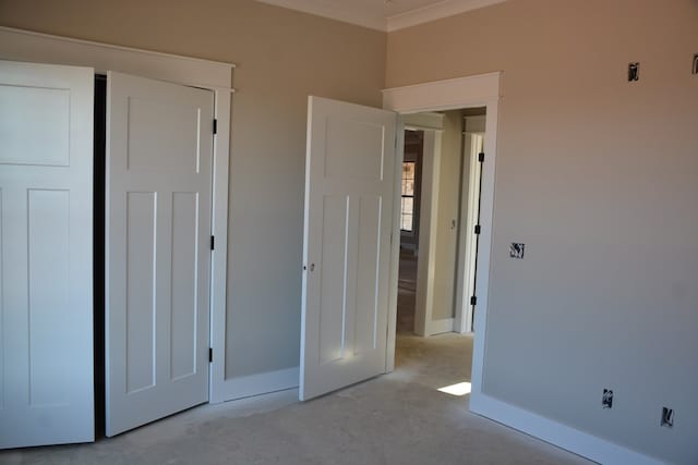 unfurnished bedroom with crown molding