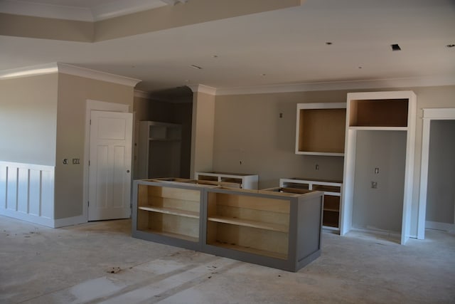 kitchen featuring a kitchen island and crown molding