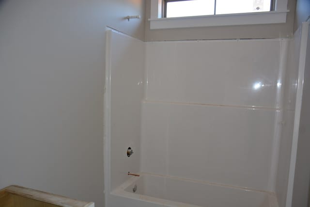 bathroom with shower / tub combination