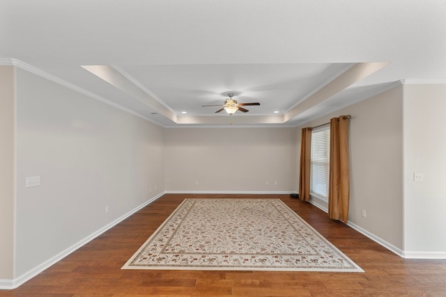 empty room featuring hardwood / wood-style flooring, ceiling fan, and crown molding