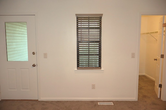 foyer featuring carpet flooring