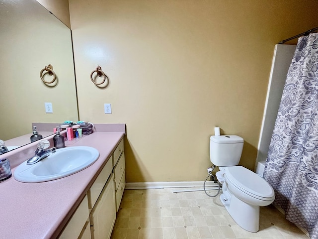 full bathroom featuring vanity, shower / tub combo, and toilet