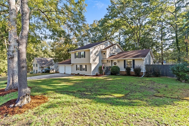 view of front of home featuring a front lawn and a garage