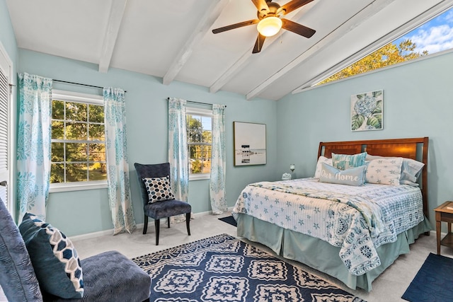 carpeted bedroom featuring ceiling fan and lofted ceiling with beams