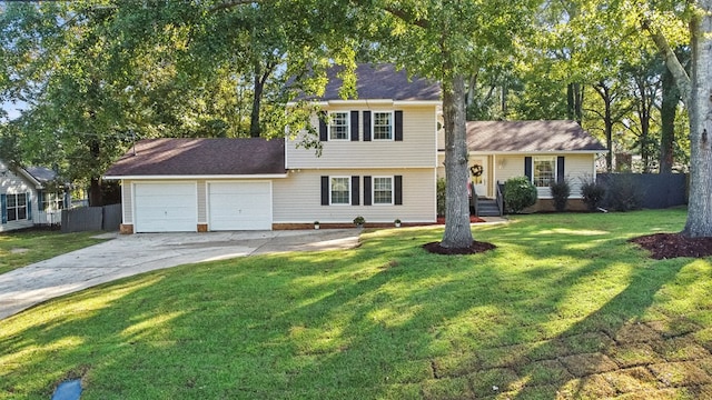 view of front of house with a garage and a front yard