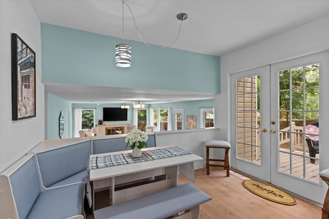 dining room featuring light hardwood / wood-style flooring and french doors