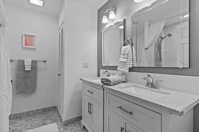 bathroom with vanity and tile patterned flooring