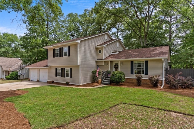 view of front of property featuring a front lawn and a garage