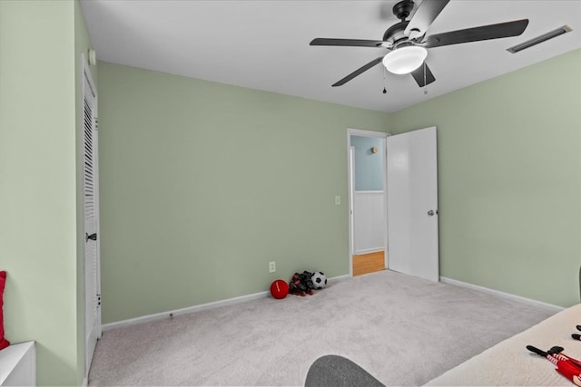 carpeted bedroom with ceiling fan