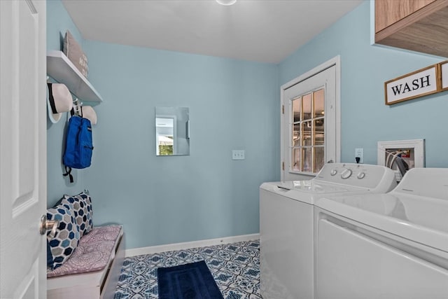 laundry room with cabinets and separate washer and dryer