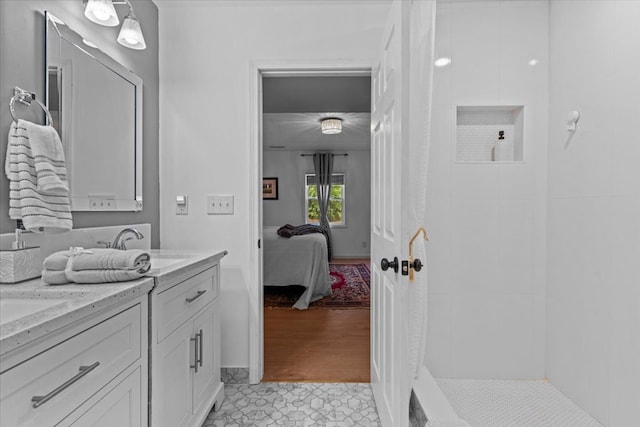 bathroom with tile patterned floors and vanity