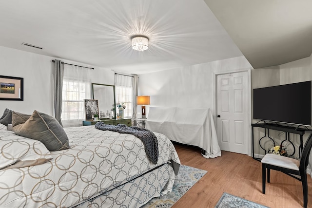 bedroom featuring wood-type flooring