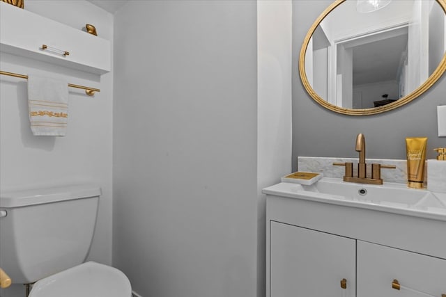 bathroom with toilet and vanity