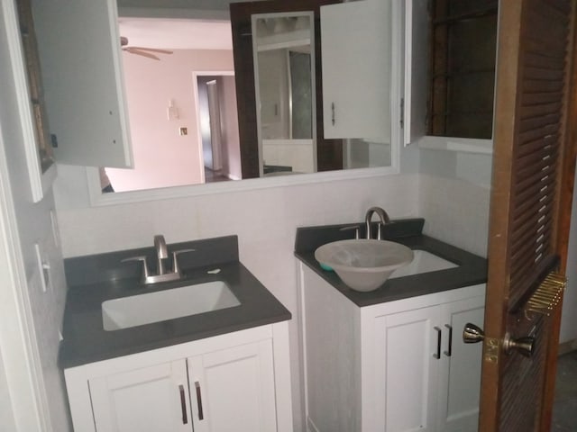bathroom with ceiling fan and vanity