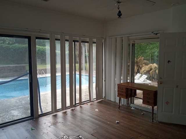 entryway with hardwood / wood-style flooring and a healthy amount of sunlight