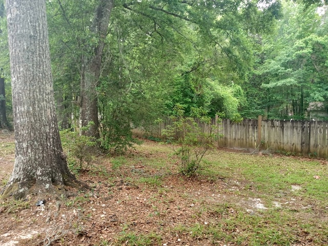 exterior space featuring a forest view