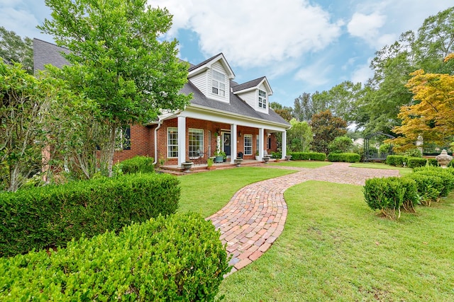 4 Woodmere Dr, Dothan, AL 36305 - cape cod home featuring covered porch, brick siding, and a front lawn
