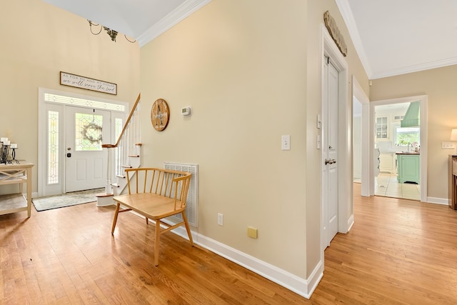 4 Woodmere Dr, Dothan, AL 36305 - foyer featuring crown molding, light wood-style flooring, a towering ceiling, and stairway