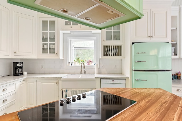 4 Woodmere Dr, Dothan, AL 36305 - kitchen featuring white appliances, white cabinets, tasteful backsplash, glass insert cabinets, and wood counters