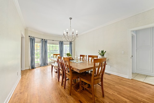 4 Woodmere Dr, Dothan, AL 36305 - dining space with a chandelier, crown molding, and light wood-type flooring