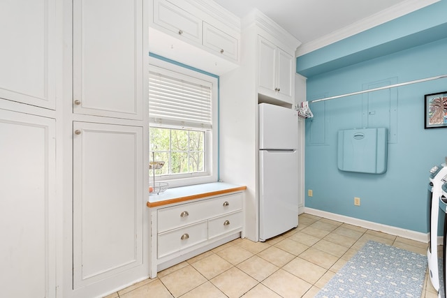 4 Woodmere Dr, Dothan, AL 36305 - kitchen featuring freestanding refrigerator, white cabinets, light tile patterned flooring, and ornamental molding