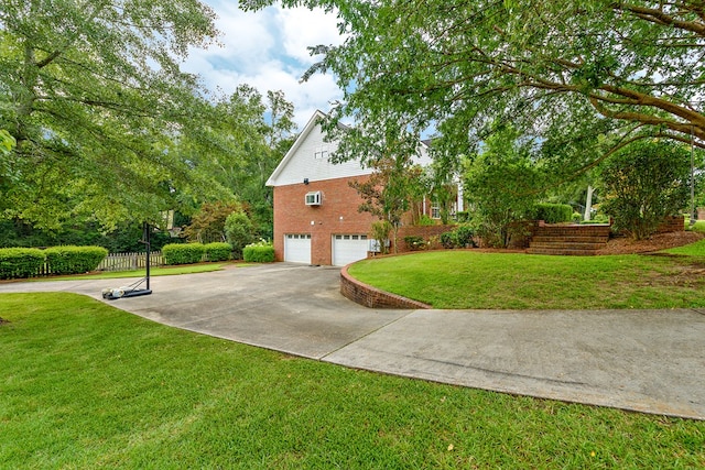 4 Woodmere Dr, Dothan, AL 36305 - view of home's exterior with an attached garage, brick siding, and driveway