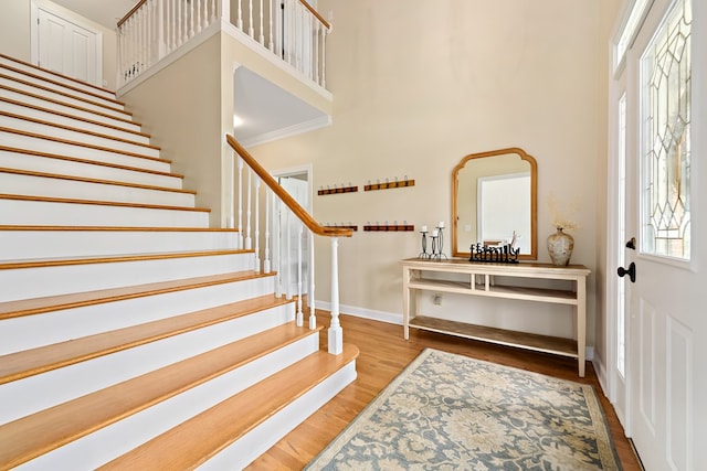 4 Woodmere Dr, Dothan, AL 36305 - foyer entrance featuring a high ceiling, stairway, and wood finished floors