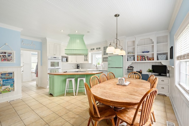 4 Woodmere Dr, Dothan, AL 36305 - dining room with light tile patterned floors and crown molding