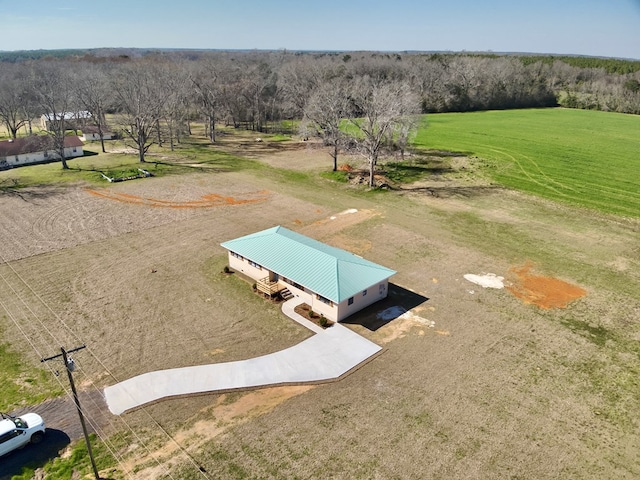 birds eye view of property with a rural view