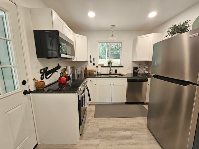 276 Fairview, Ozark, AL 36360 - kitchen featuring stainless steel appliances, dark countertops, light wood-style floors, white cabinetry, and recessed lighting